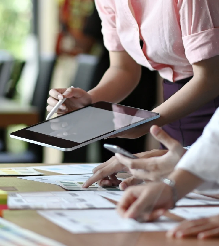 Team working with a tablet at a table